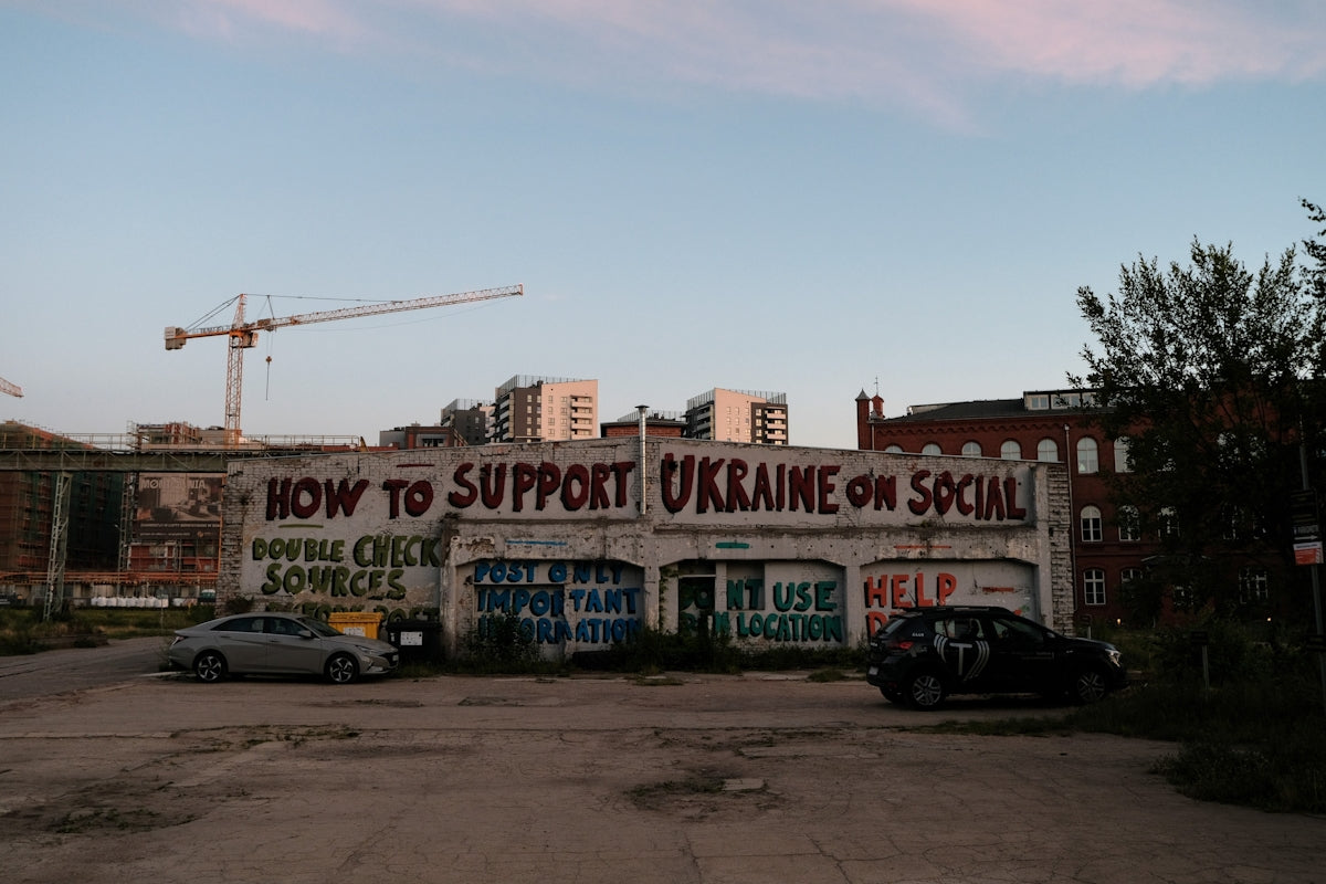 a building with a sign that says how to support ukraine on social