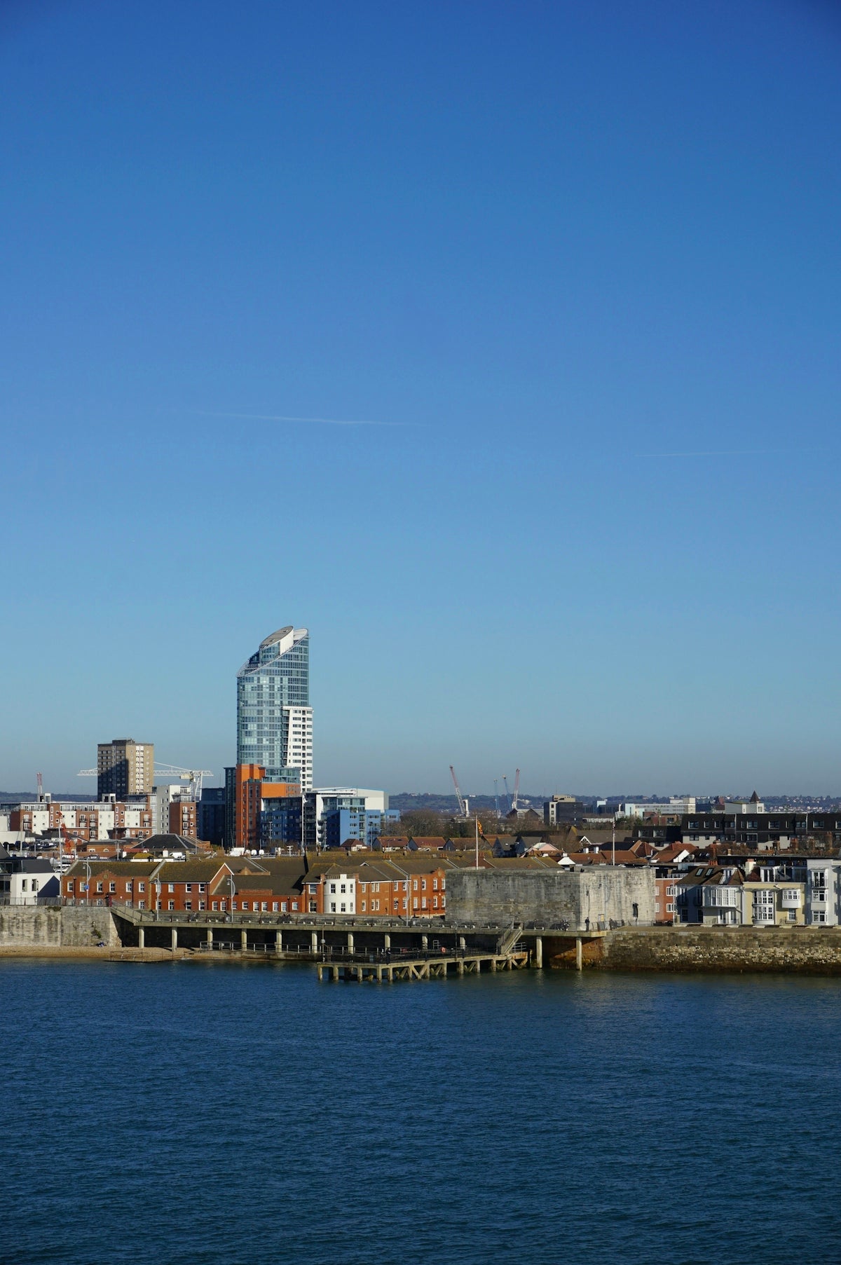 City skyline with modern and historic buildings by the water