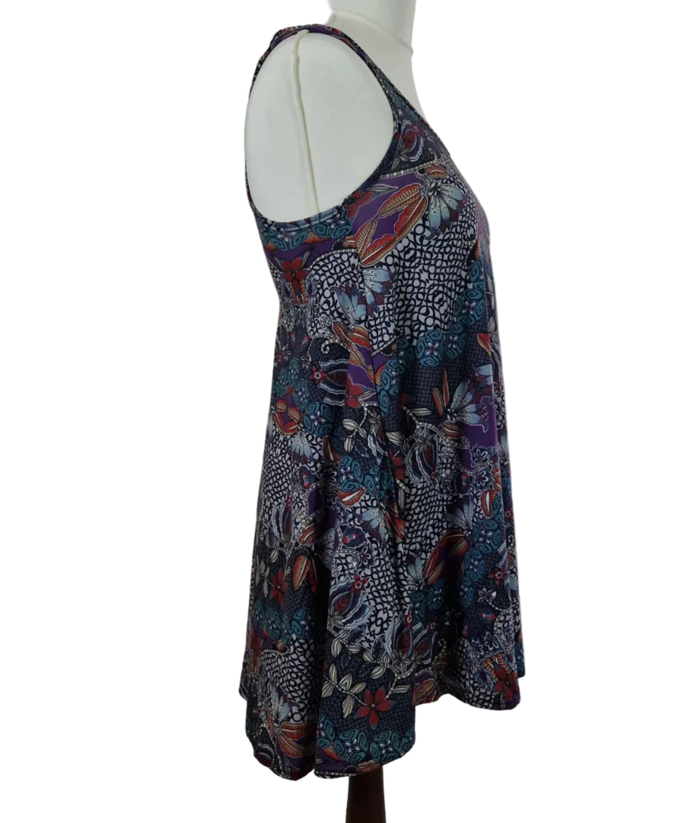 A sleeveless Boohoo beach top featuring a multicoloured floral and geometric pattern.