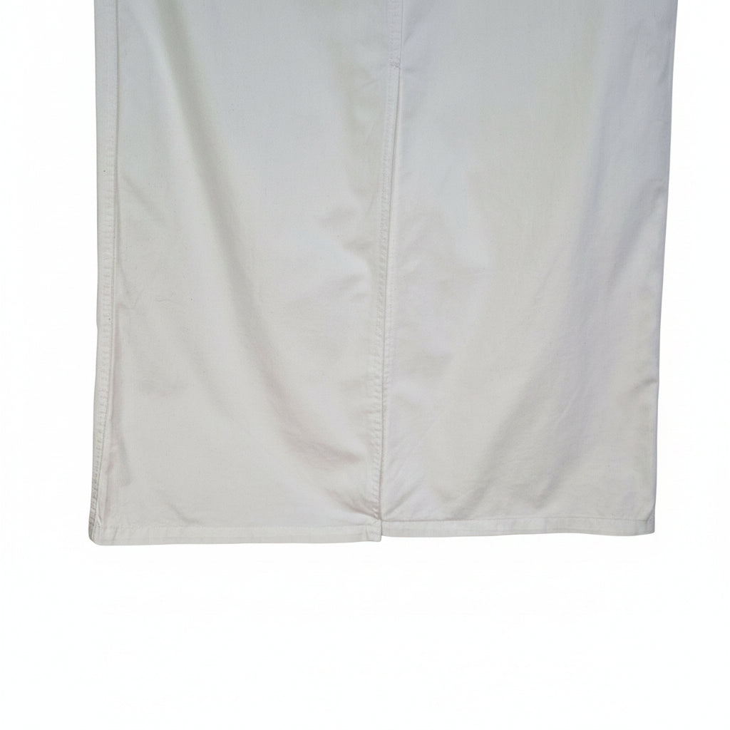 A white Uniqlo A-line midi skirt made from structured cotton twill fabric.
