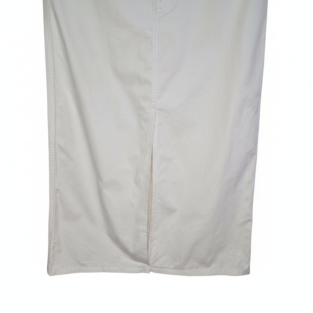A white Uniqlo cotton twill A-line midi skirt with a central front slit.