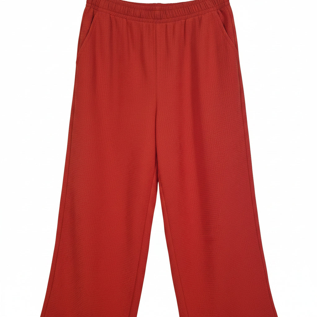 Unbranded women's red wide-leg trousers with an elasticated waist and textured fabric.