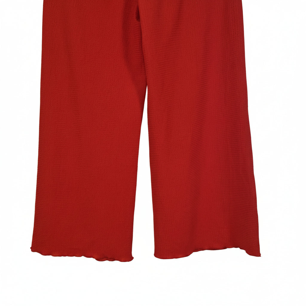 Red wide-leg trousers for women featuring a textured fabric and scalloped hems.