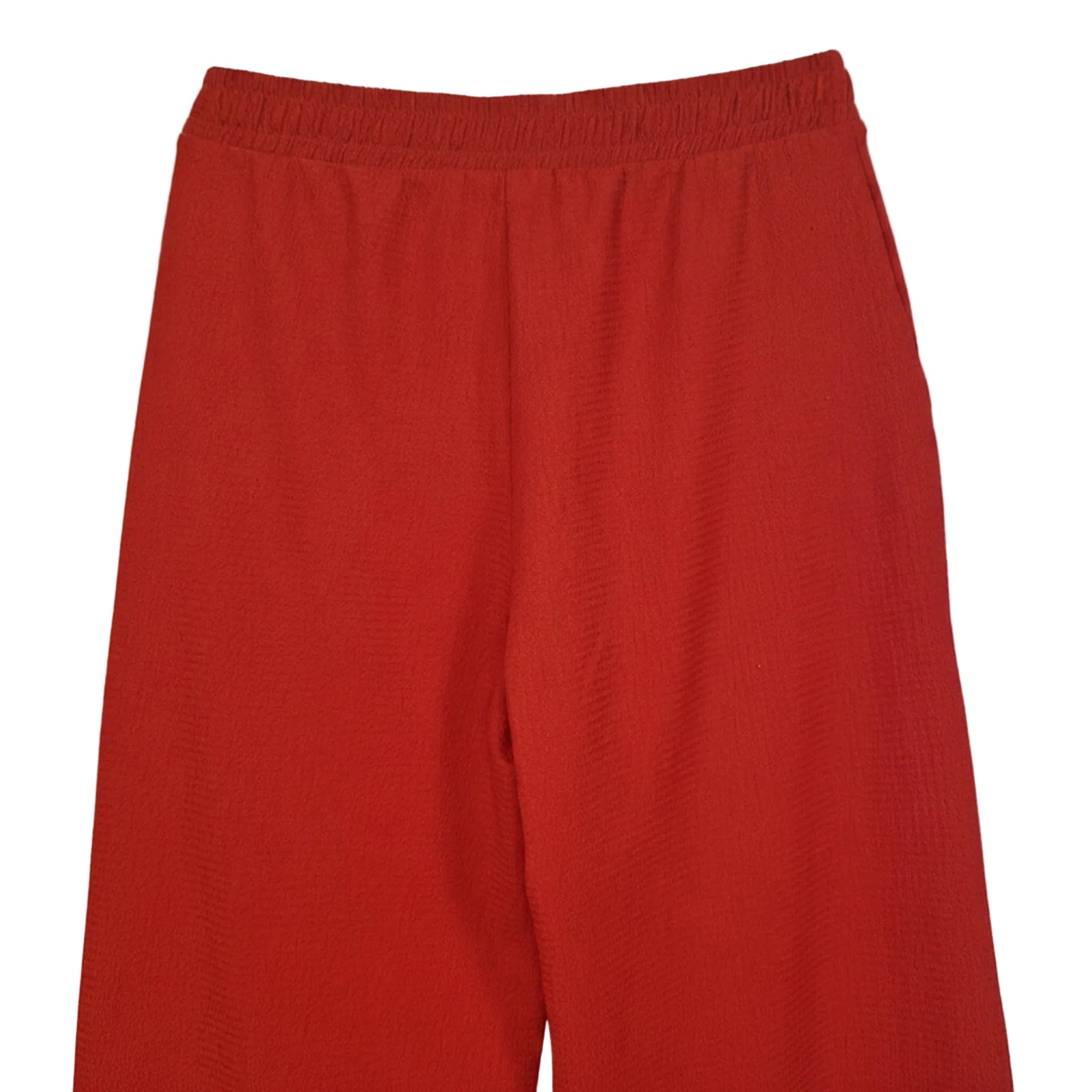 A pair of red wide-leg trousers for women featuring an elasticated waistband and textured fabric.