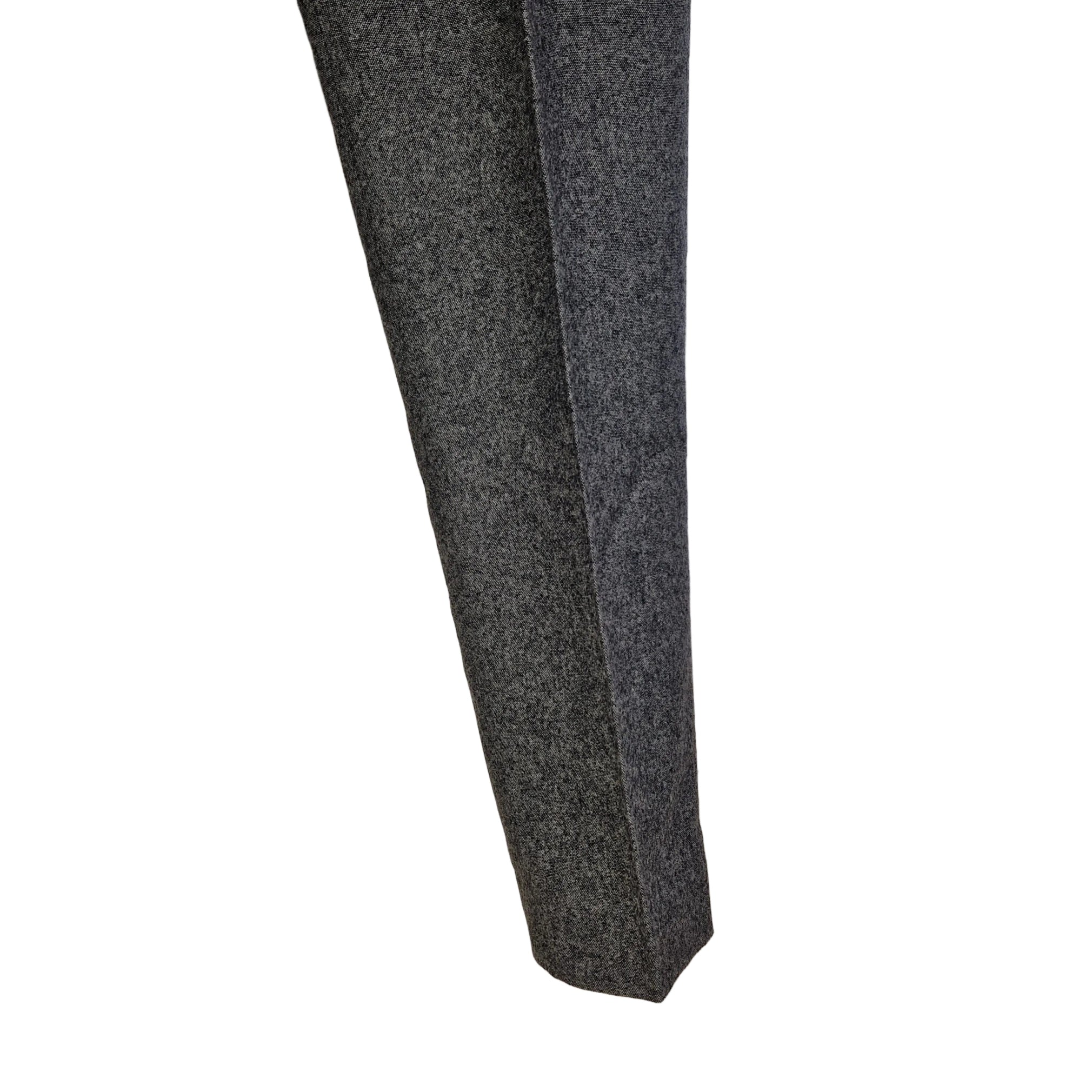 A close-up of a grey wool blend formal trouser leg with a classic straight fit.