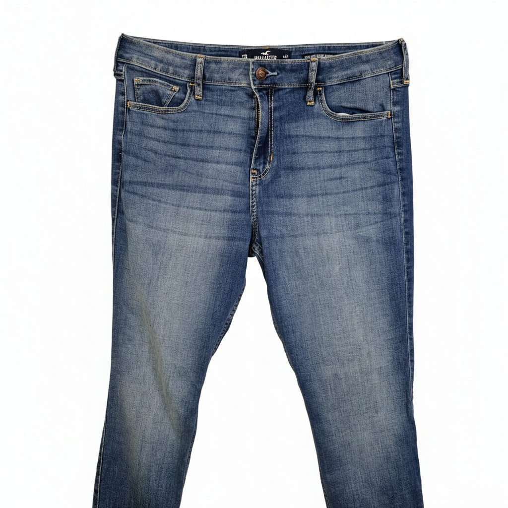 Hollister men's high-rise super skinny blue denim jeans with a medium wash and whiskering.