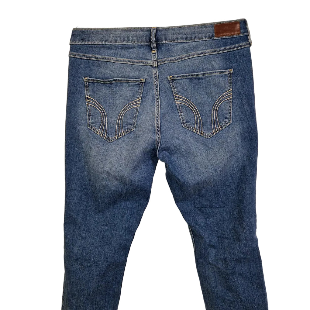 Hollister men's medium blue denim jeans featuring a high-rise, super skinny fit.