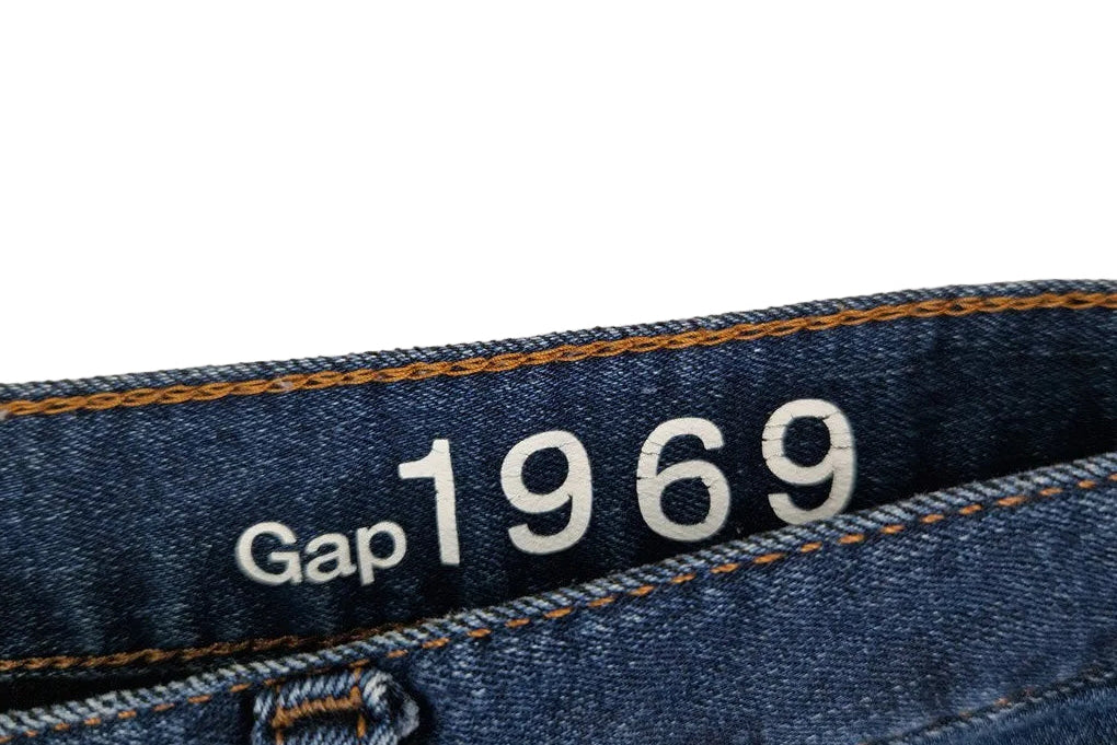 A close-up view of the inner waistband of blue Gap 1969 stretch denim jeggings.