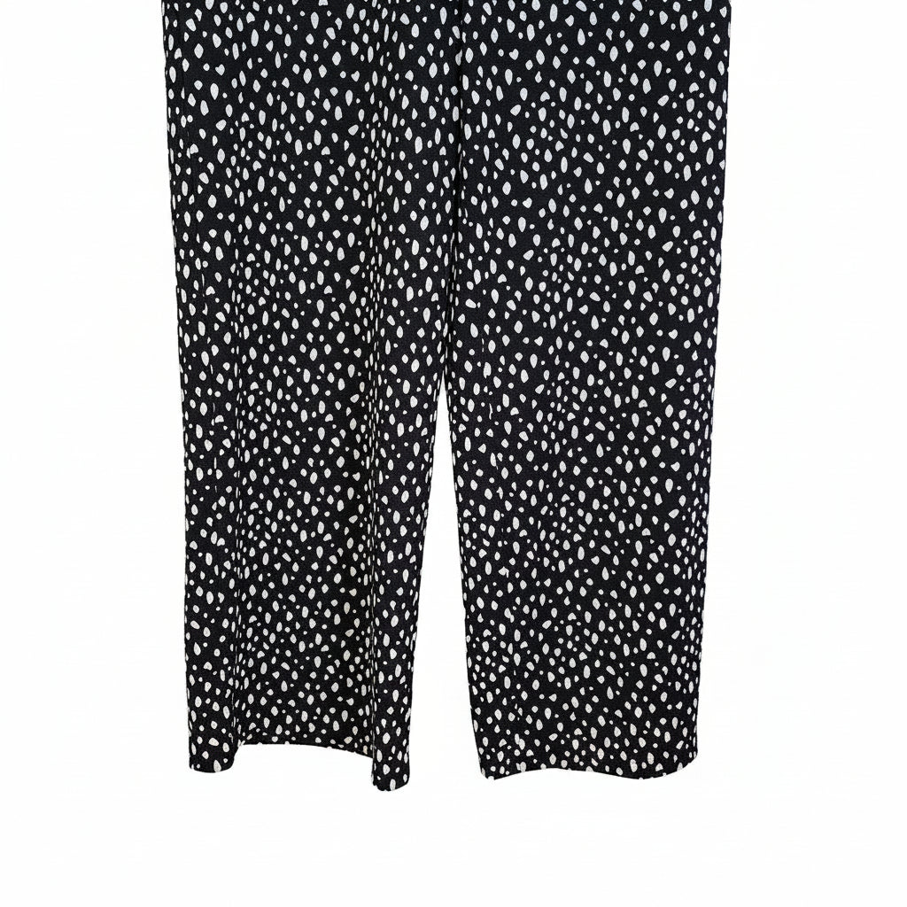 Black tapered trousers featuring a white speckled pattern and a pull-on design.