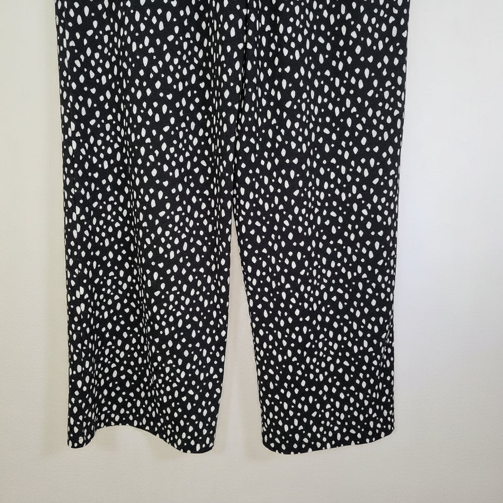 F&F black tapered trousers featuring a white speckled pattern and a pull-on design.