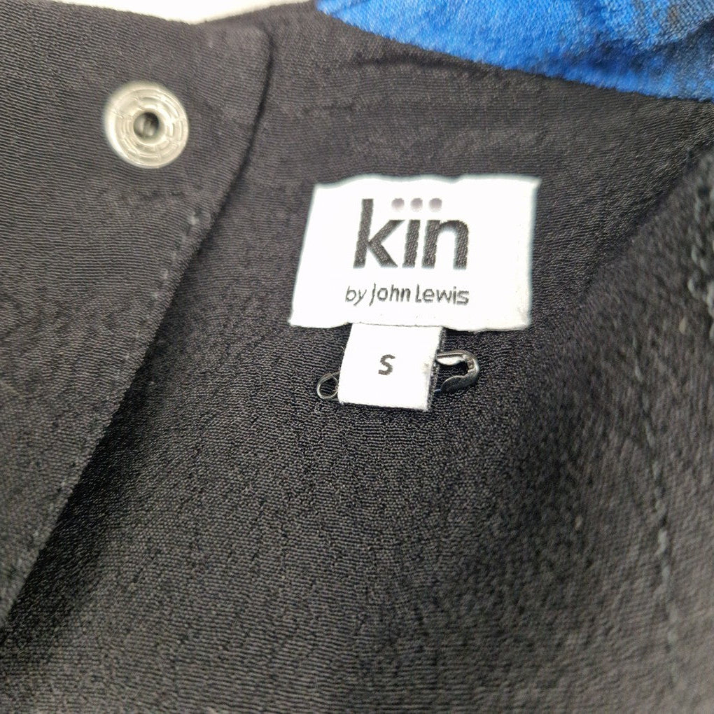 A close-up of a black Kin by John Lewis clothing label with a size small tag attached.