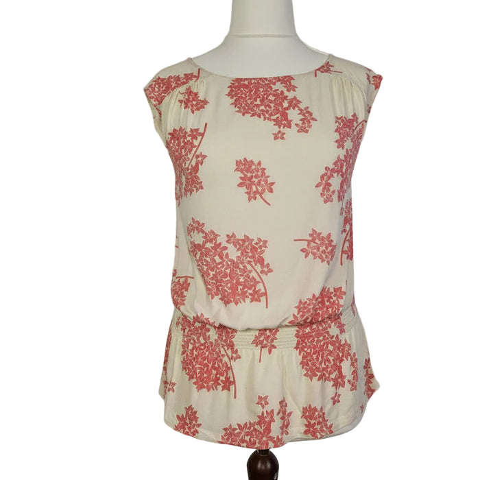 F&F sleeveless blouse in cream with a pink floral print and a smocked hem.