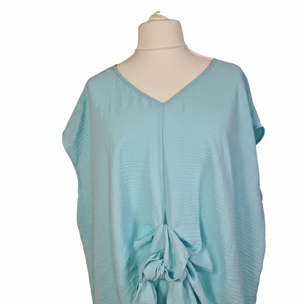 A light blue George women's blouse featuring a V-neckline and a tie-front detail.