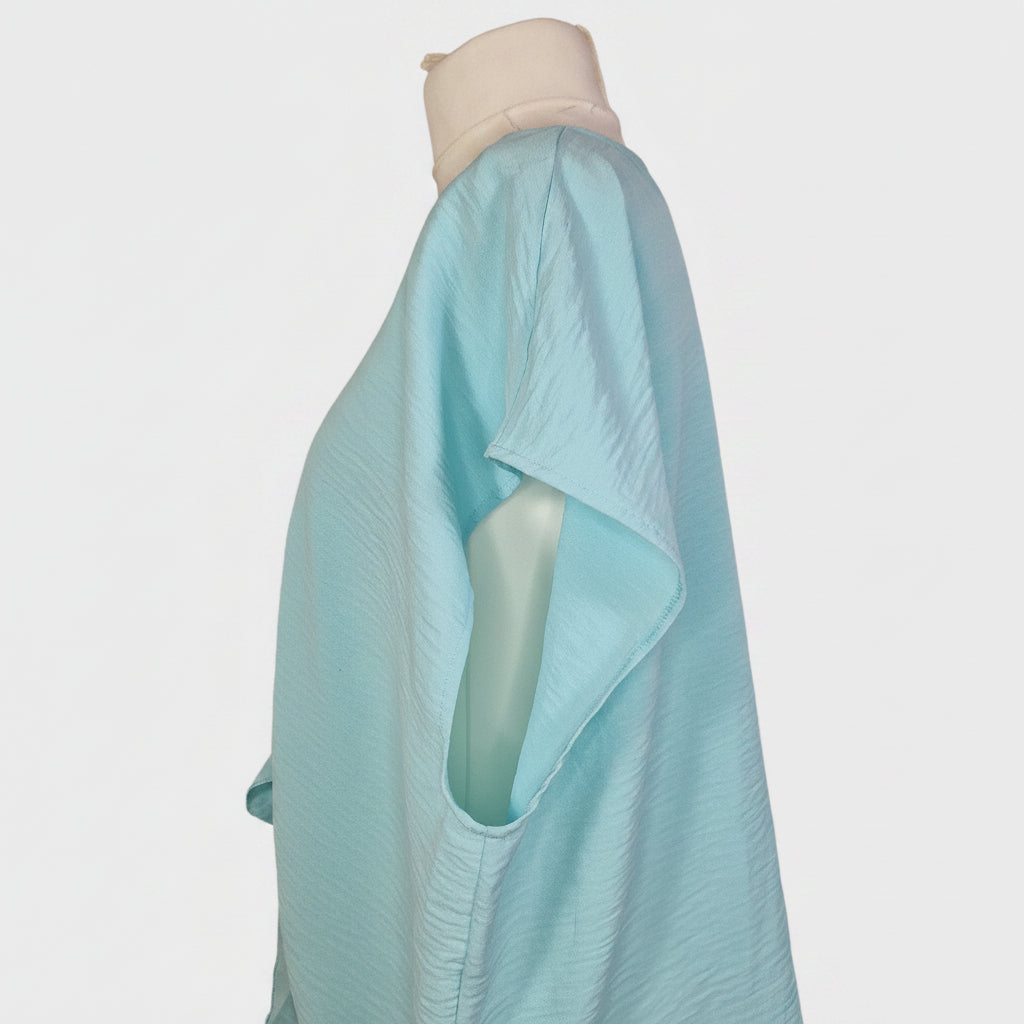 A light blue George women's blouse with short sleeves shown from the side on a mannequin.