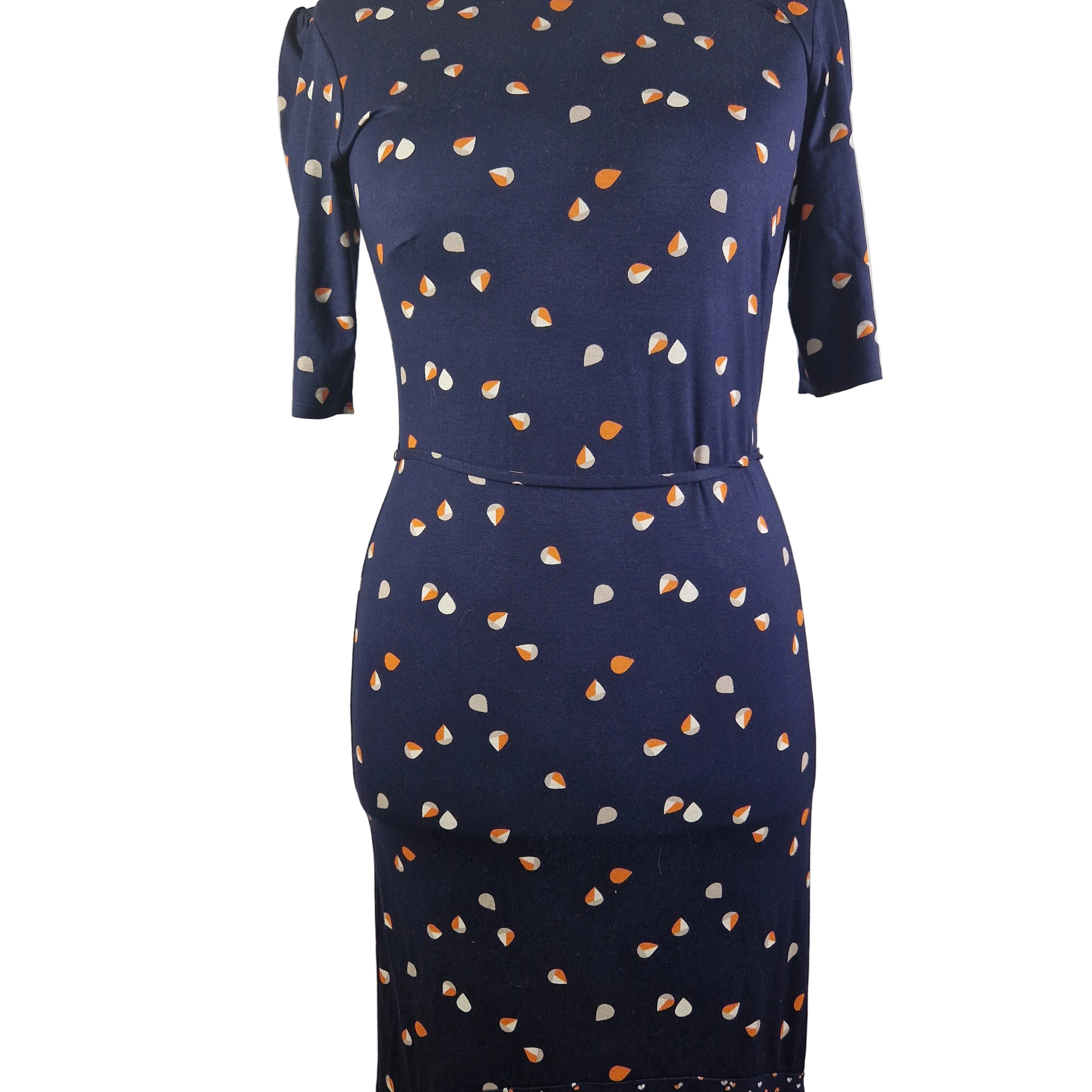 A navy blue knee-length fit and flare dress featuring a white and orange teardrop print.