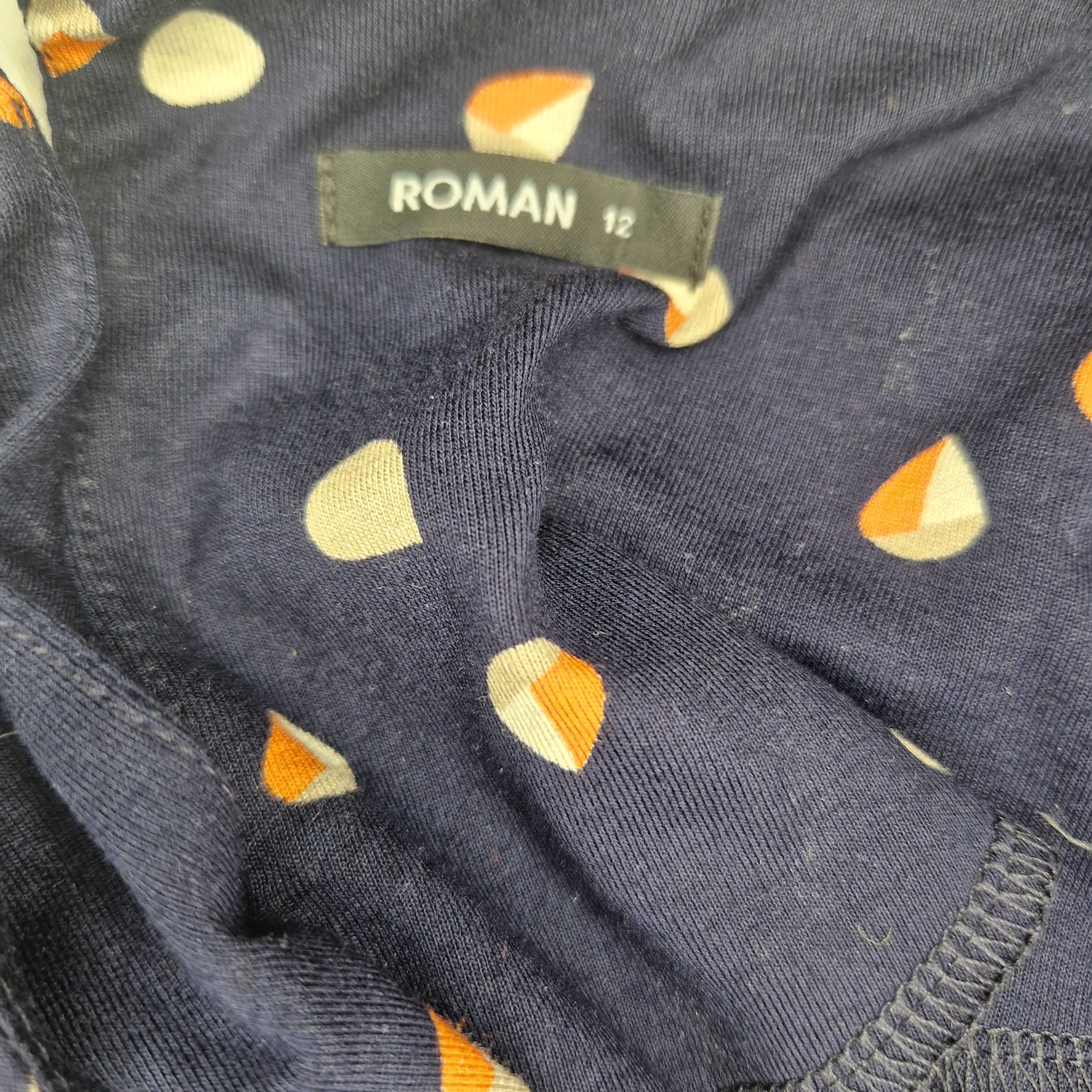 A navy blue Roman dress in size 12 featuring a repeating teardrop print in orange and cream.