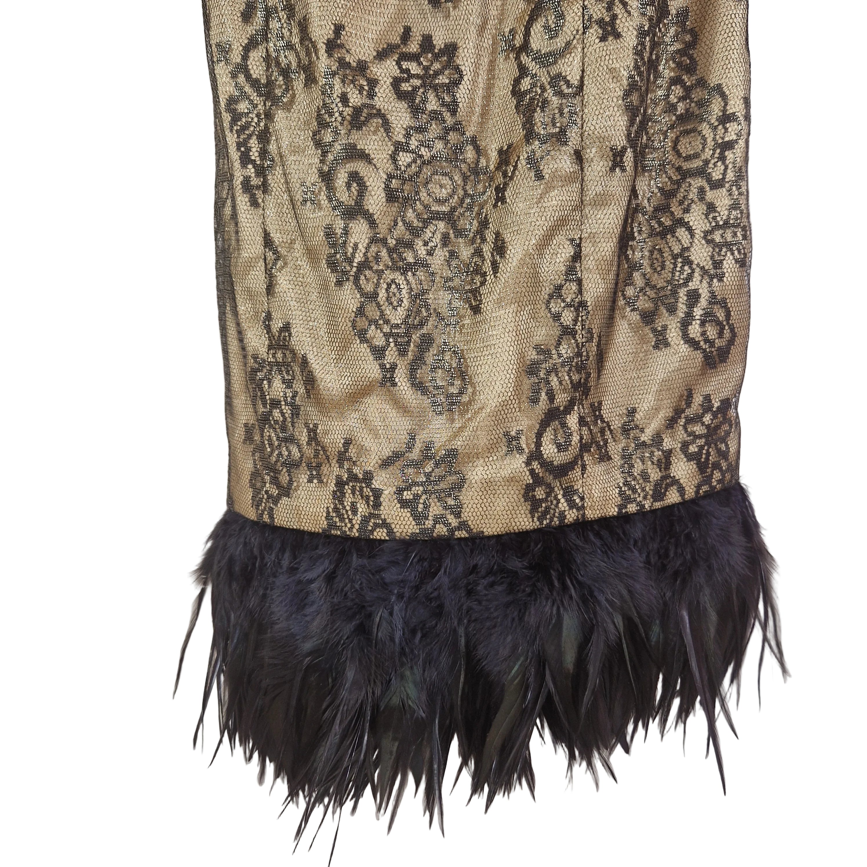 Decorative fabric with black lace pattern and black feathers on a beige background