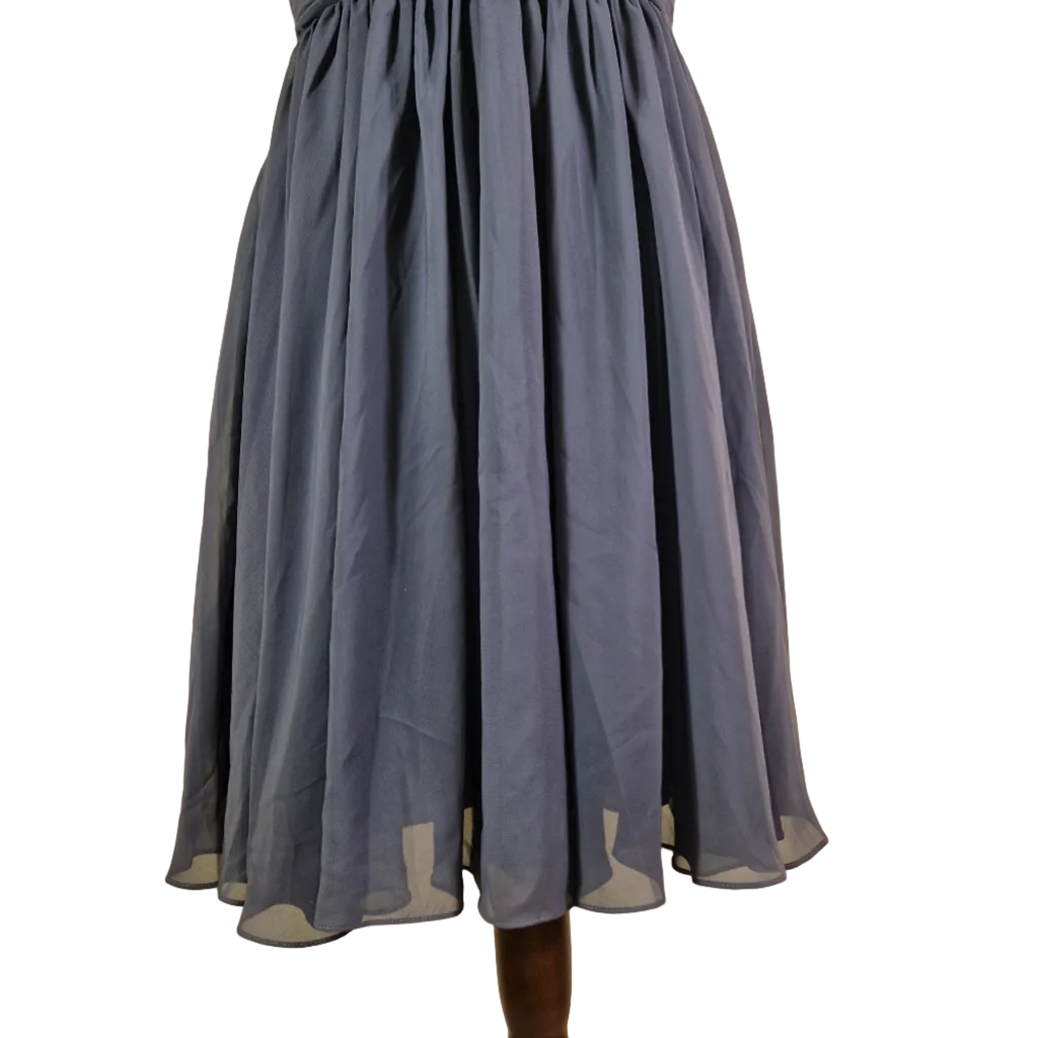 Blue pleated skirt on a beige background