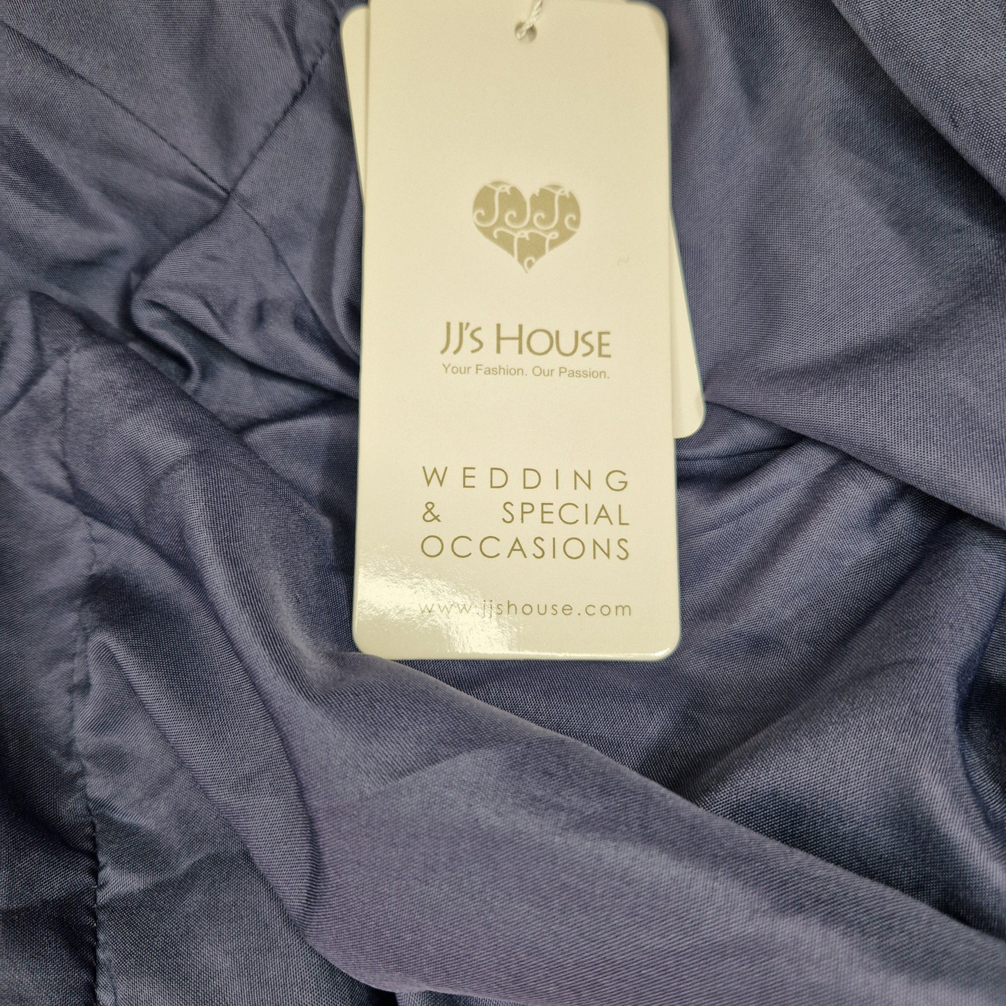 JJ's House wedding and special occasions card on a dark fabric background