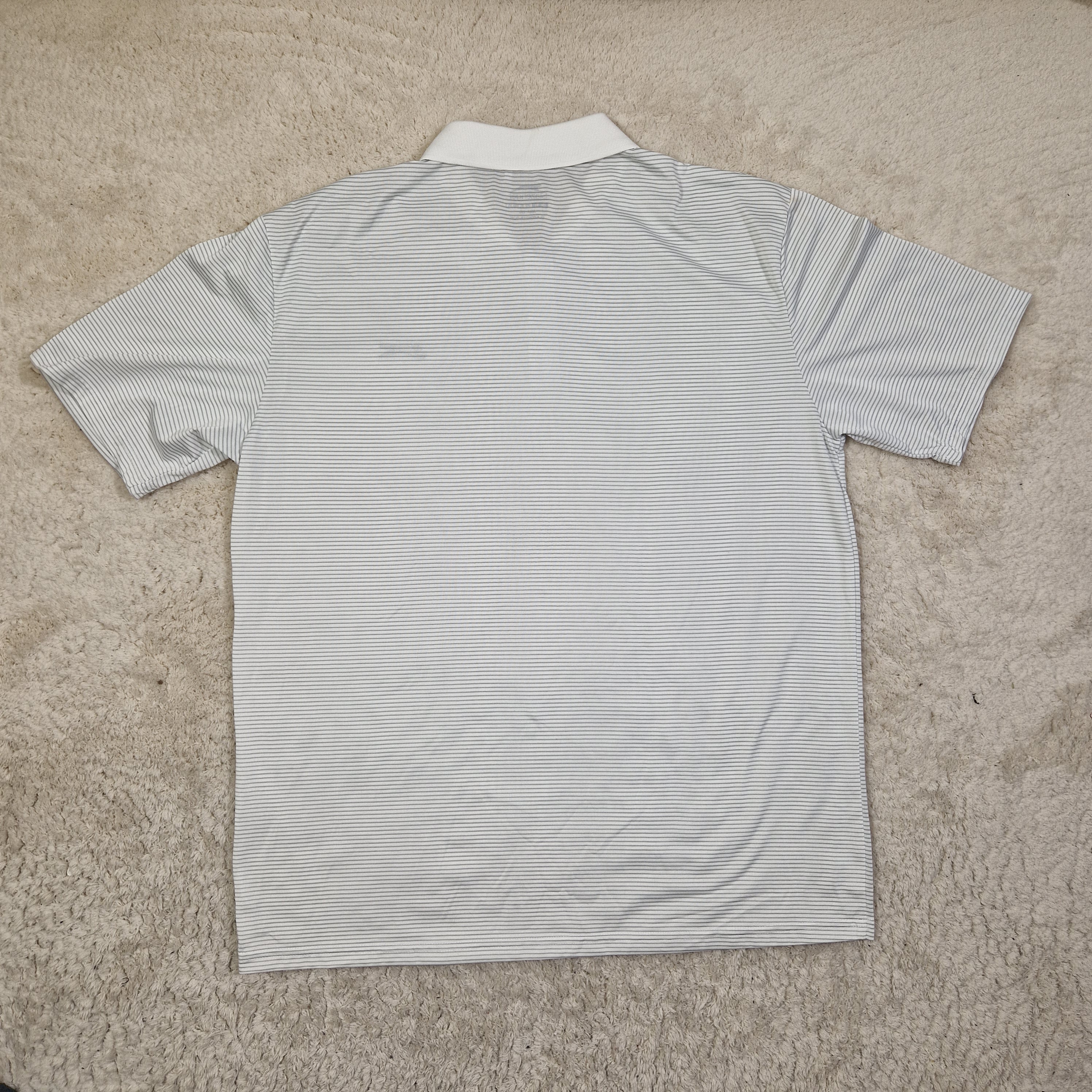 Striped shirt on a beige carpet