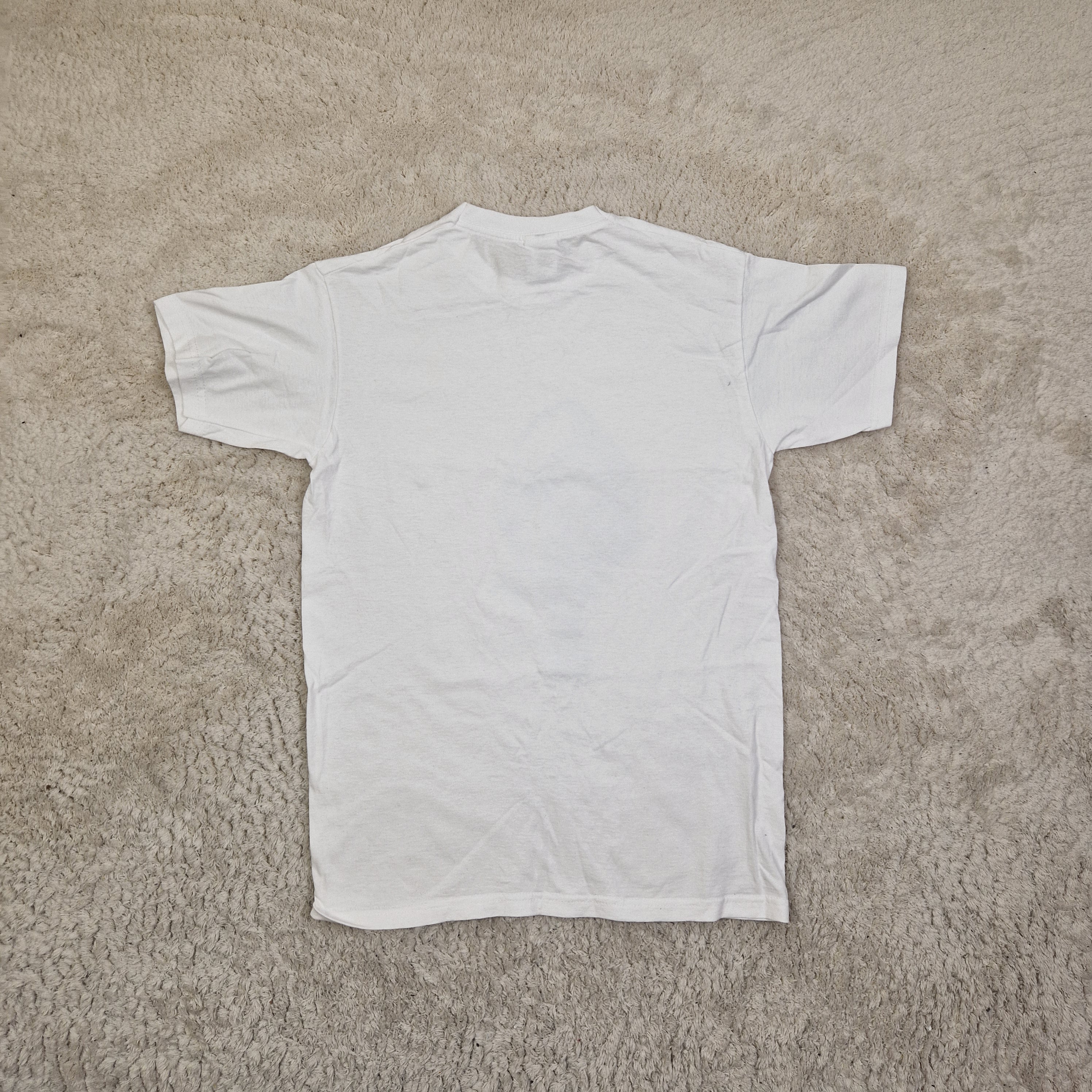 White t-shirt on a beige carpet