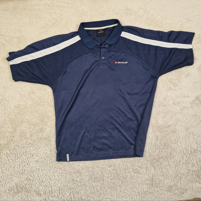 Navy blue athletic shirt with white stripes on a beige carpet