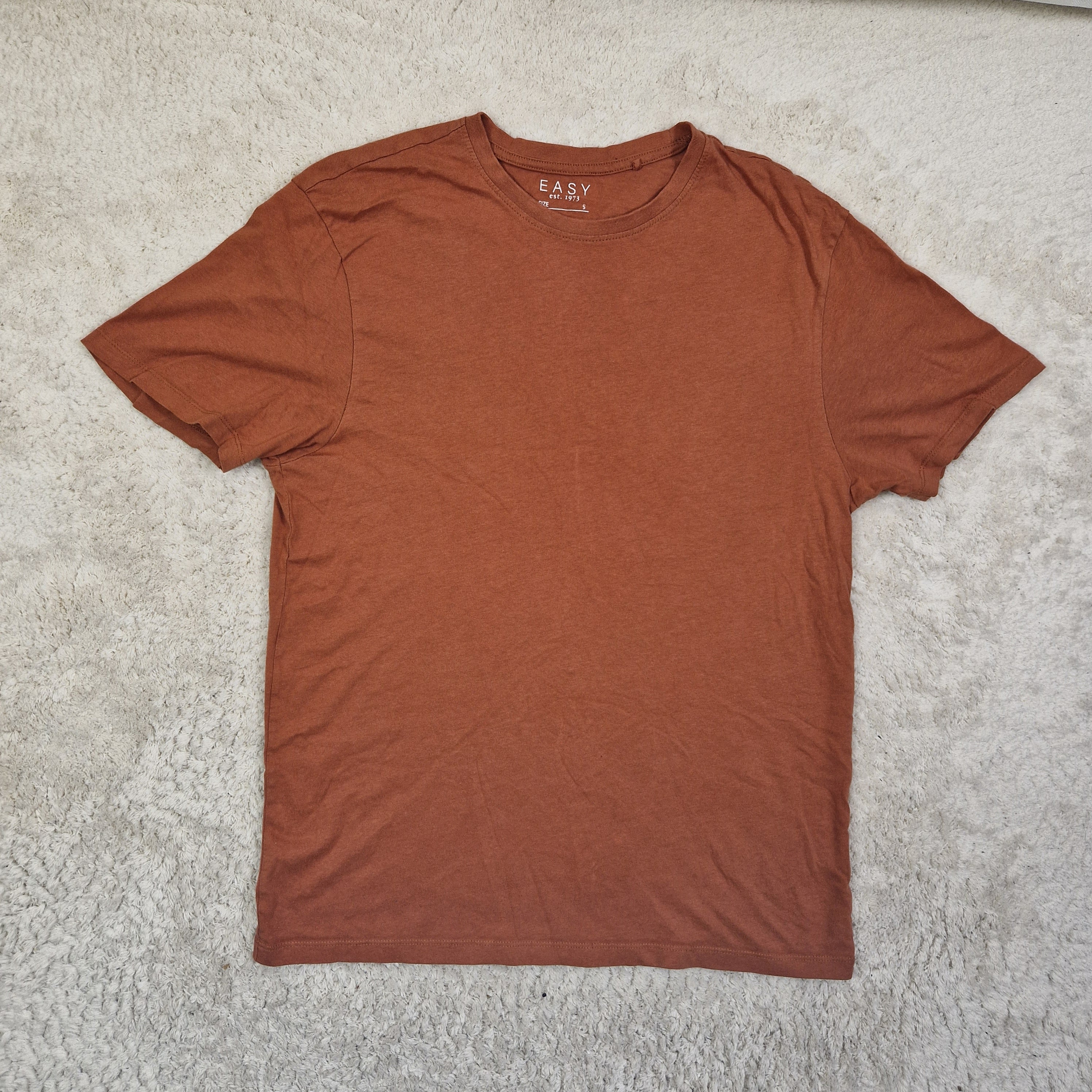 Brown tank top on a textured surface