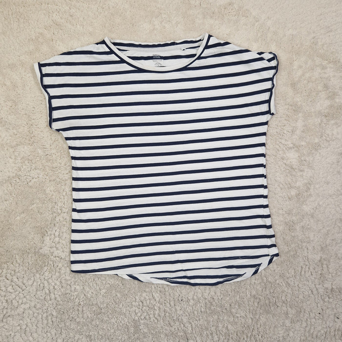Black and white striped shirt on a beige carpet