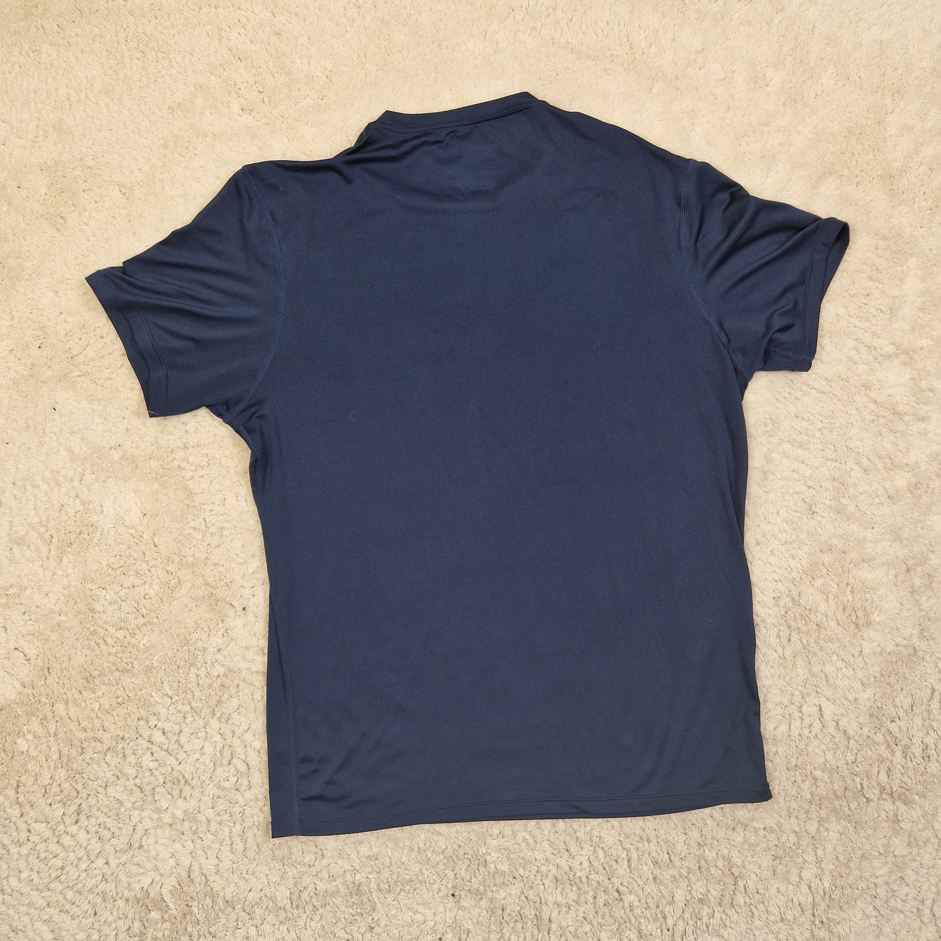 Blue t-shirt on a beige carpet