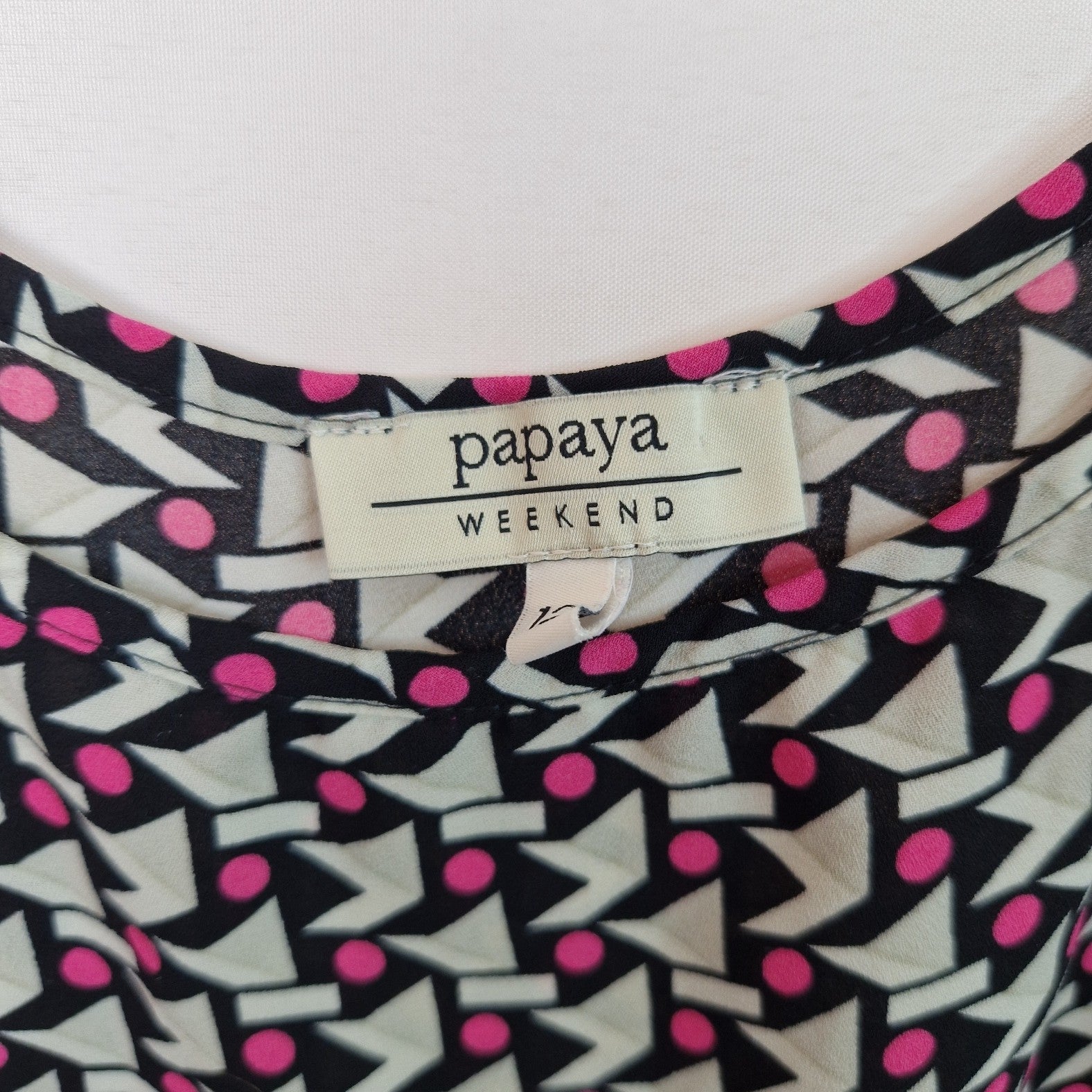 A Papaya sleeveless chiffon cami top featuring a geometric pattern in pink, black, and white.