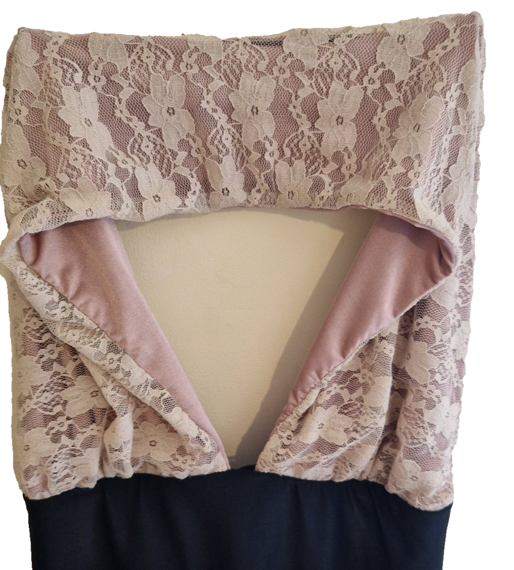 A pink lace ball gown featuring a sleeveless halter neckline and a modern cut-out back.