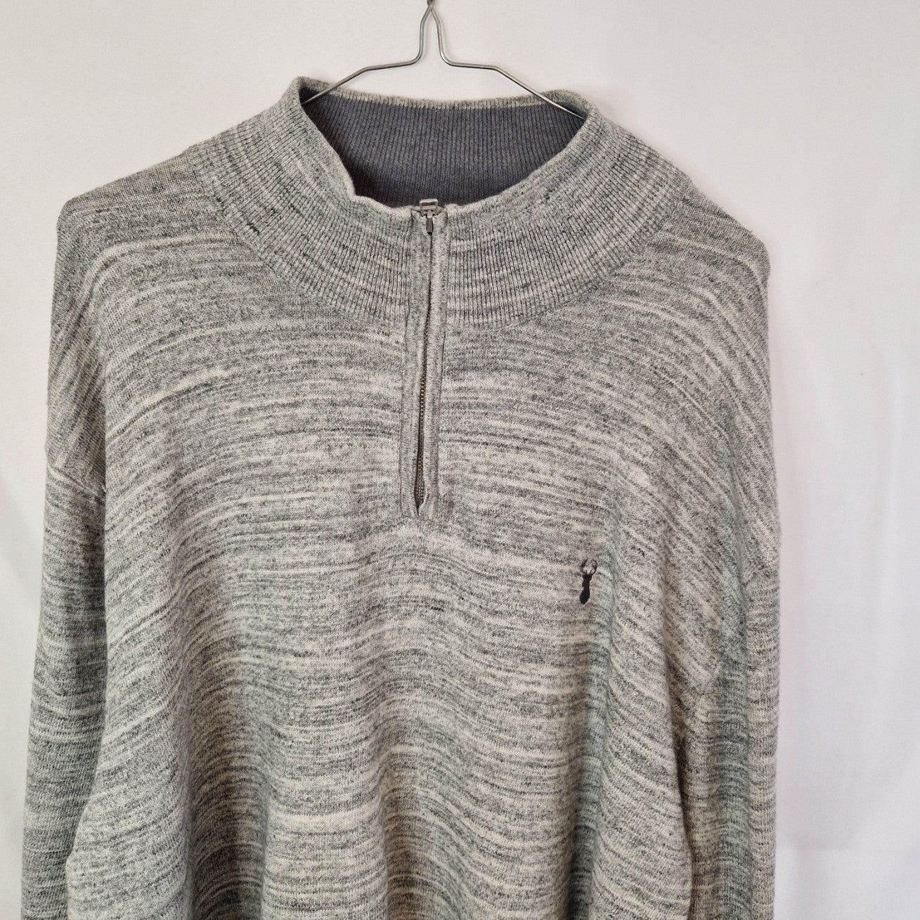 A grey Next quarter-zip knit pullover with a small logo on the chest.