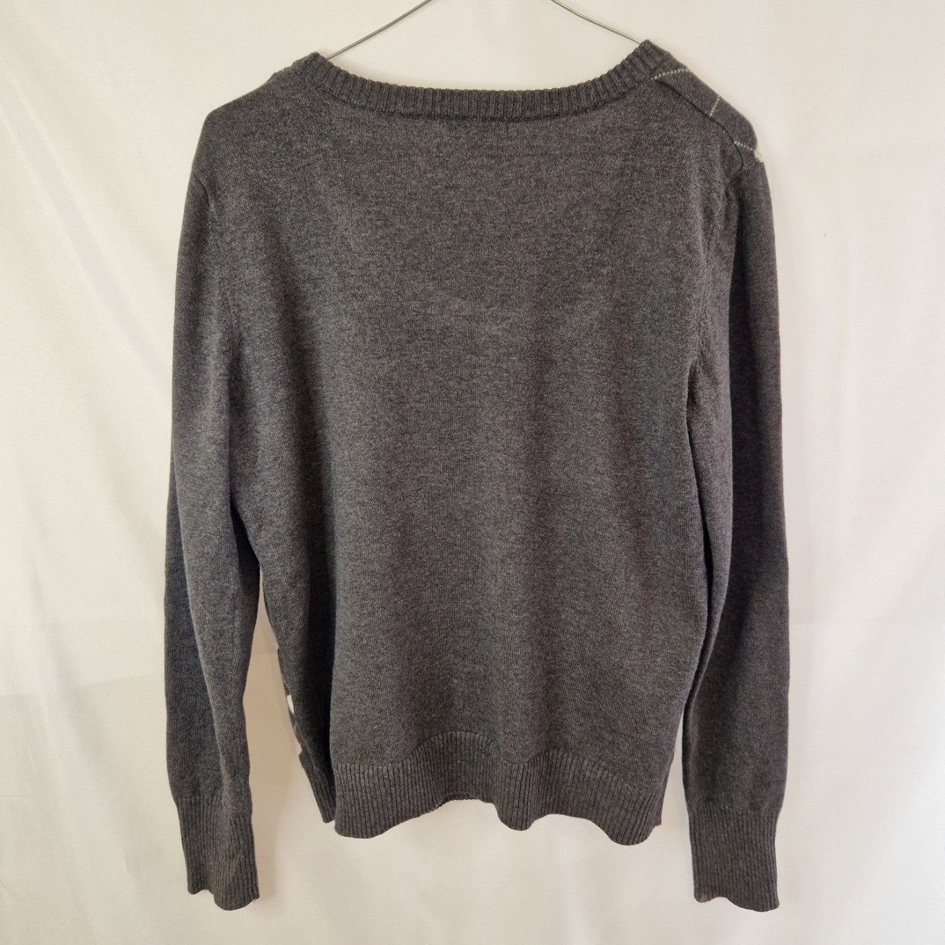 A grey Papaya long-sleeved jumper with a round neck and a heart pattern.