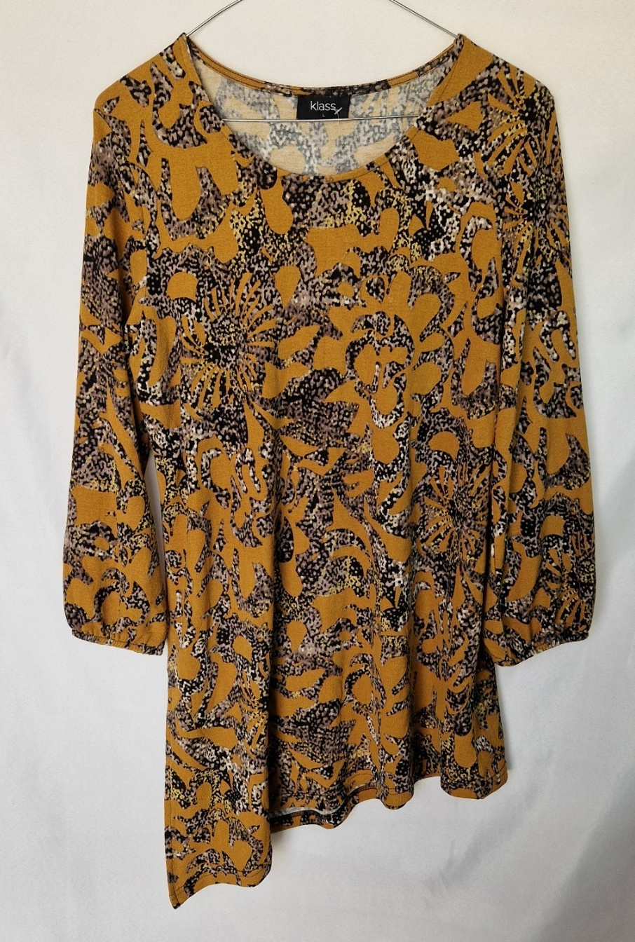 A yellow long-sleeve tunic top by Klass featuring a round neck and an asymmetric hem.