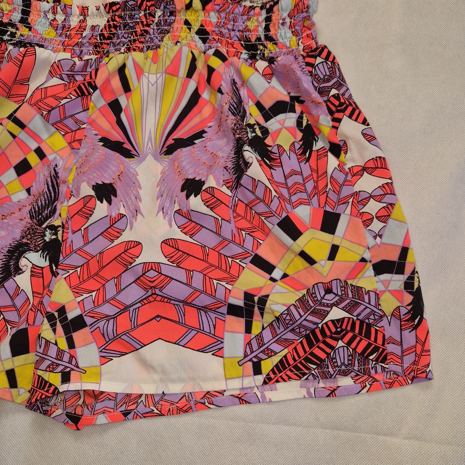 A multicoloured River Island playsuit featuring an off-the-shoulder neckline and floral print.