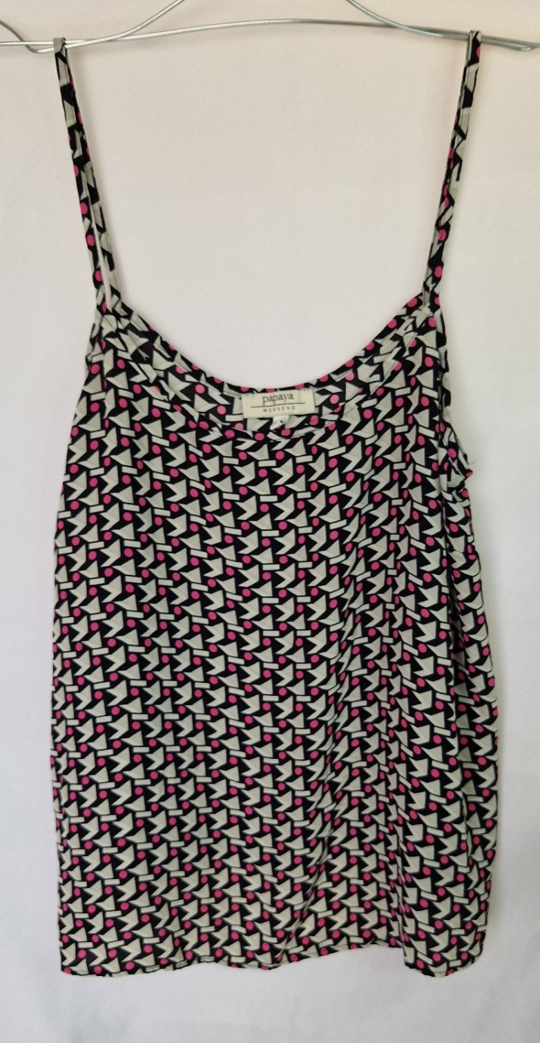 A sleeveless Papaya chiffon cami top featuring a geometric pattern in pink, black, and white.