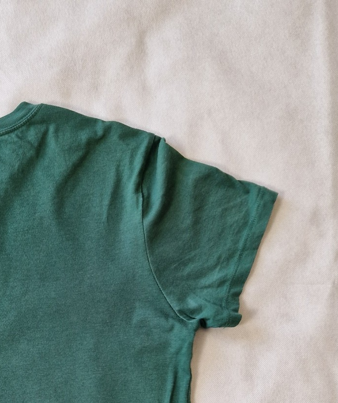 A green H&M Divided short-sleeved cotton jersey t-shirt with a roll neck.