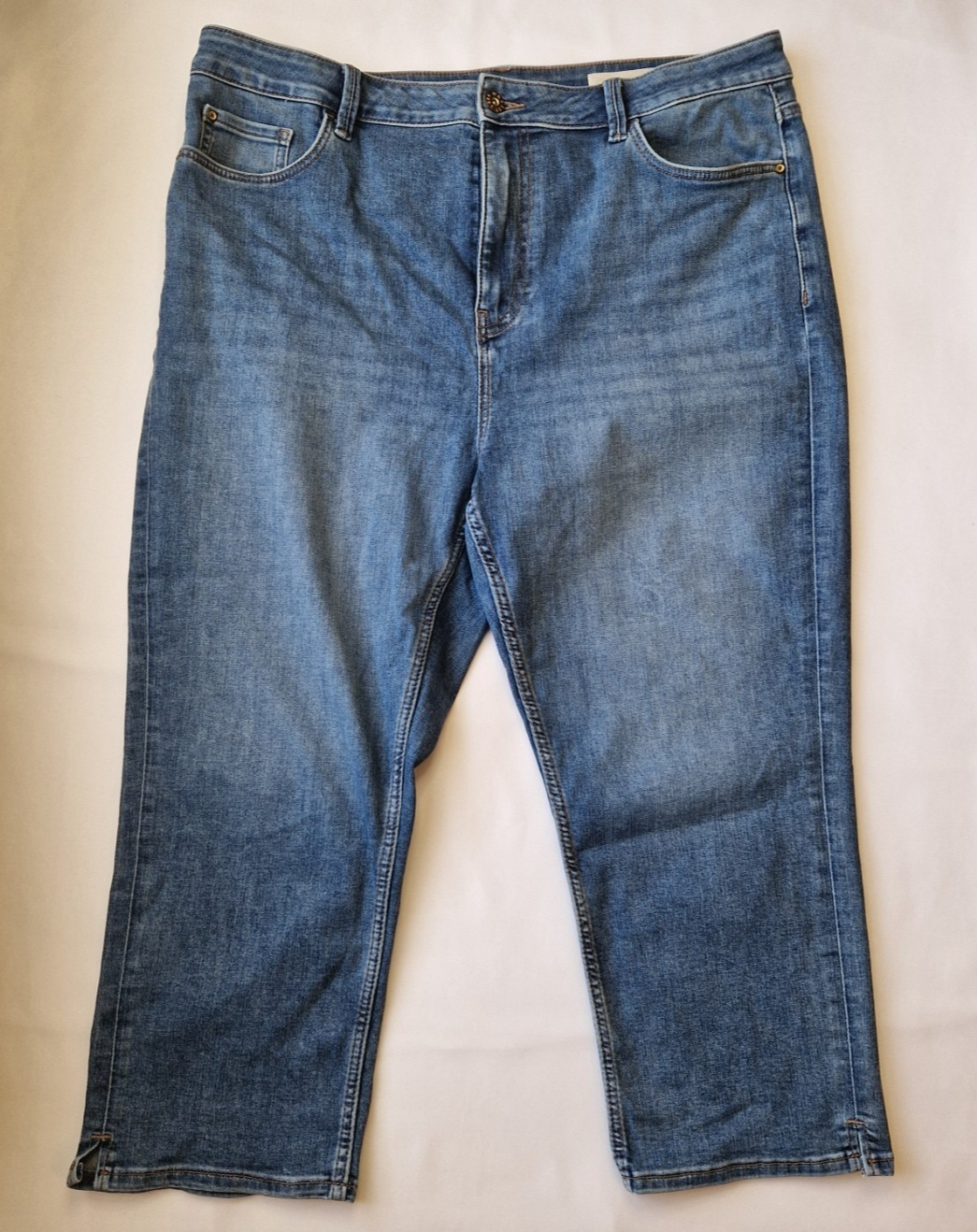 Marks and Spencer mid-rise blue stretch denim skinny jeans with a five-pocket design.