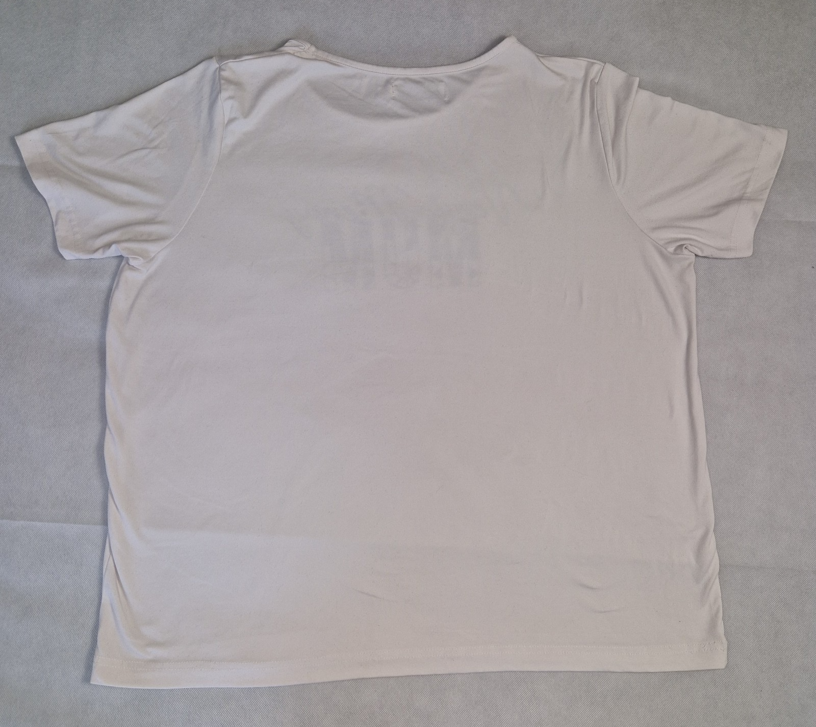 A plain white short-sleeved cotton jersey t-shirt with a round neckline.