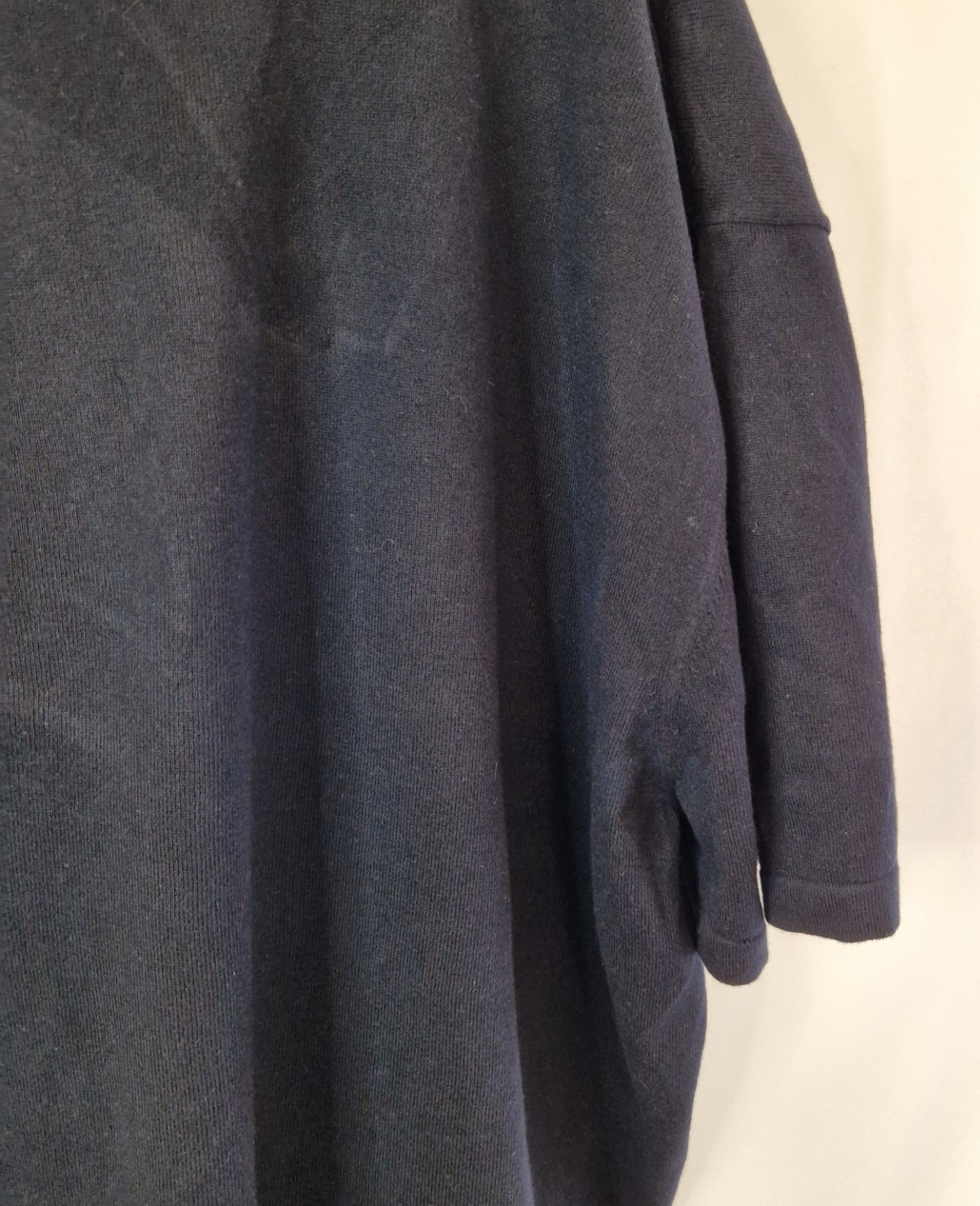 A dark blue short-sleeve cotton V-neck polo shirt from Next.