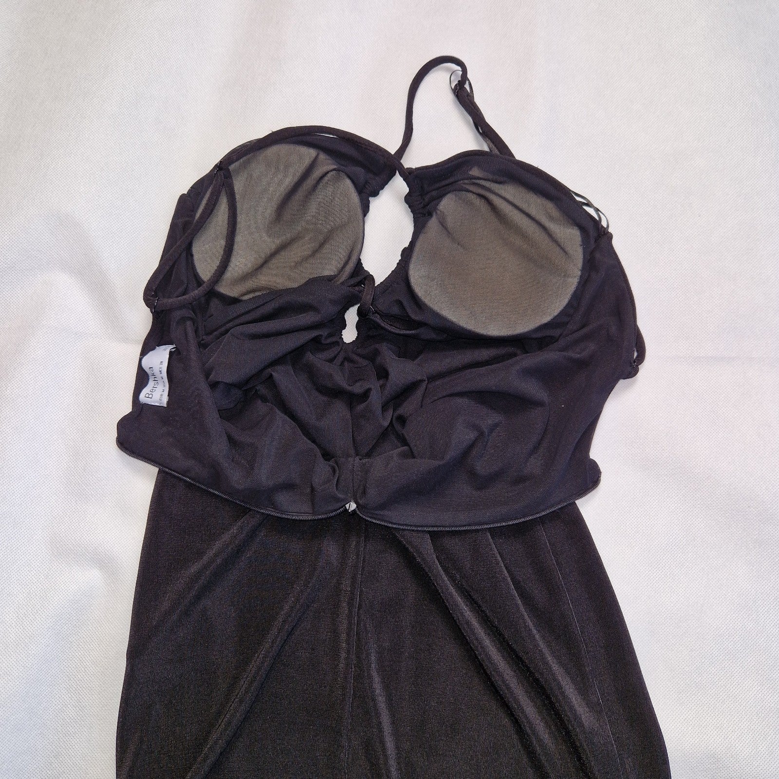 Bershka black off-shoulder crop top with integrated padding and thin straps.