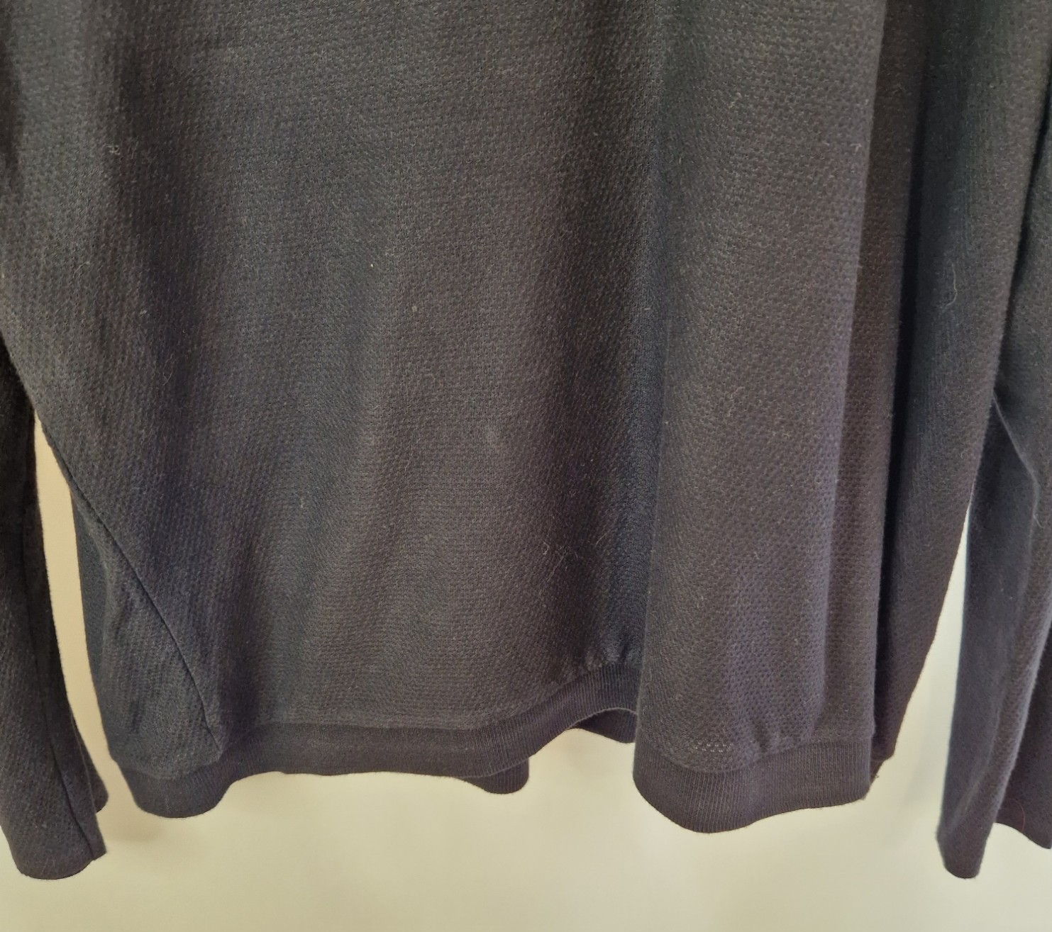 A black Zara Man slim fit cotton knit sweater with a crewneck and ribbed hem.
