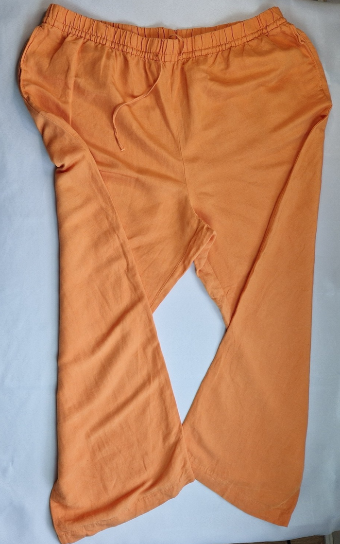 H&M orange wide-leg jogger trousers with an elasticated drawstring waist.