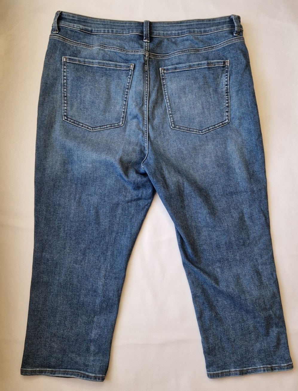 Marks and Spencer mid-rise blue stretch skinny jeans with a classic five-pocket design.