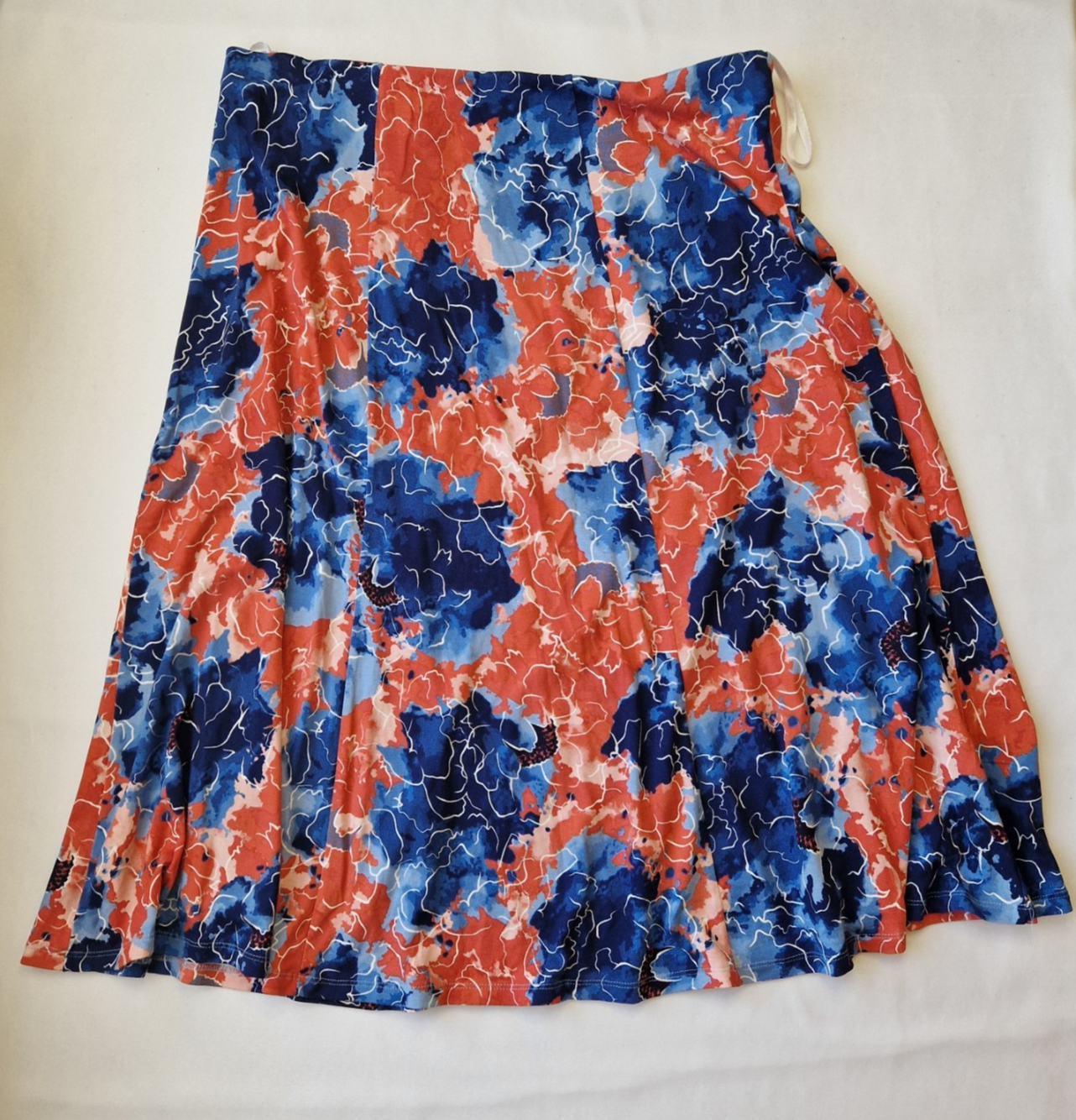 Honor Milburn midi skirt in a multicolour floral print with an asymmetric hem.