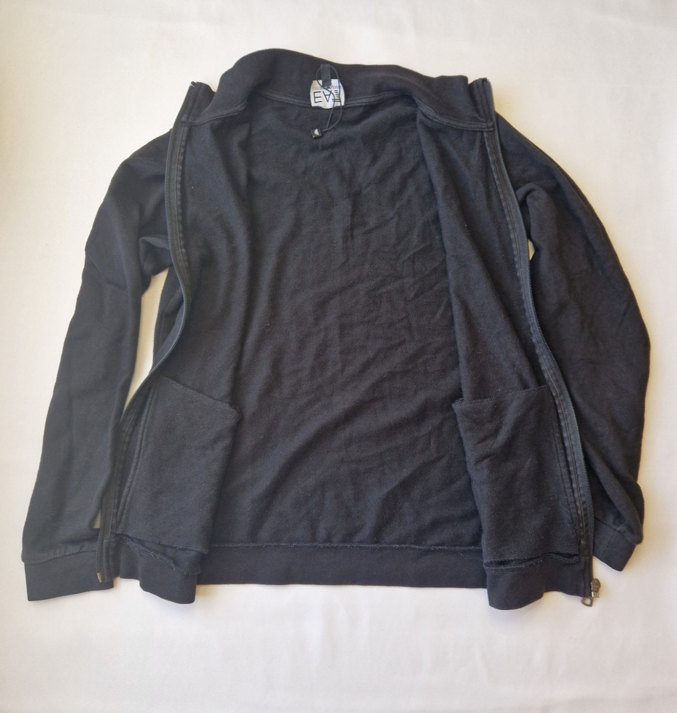 A black EA7 Emporio Armani junior zip-up bomber jacket made from flannel fabric.