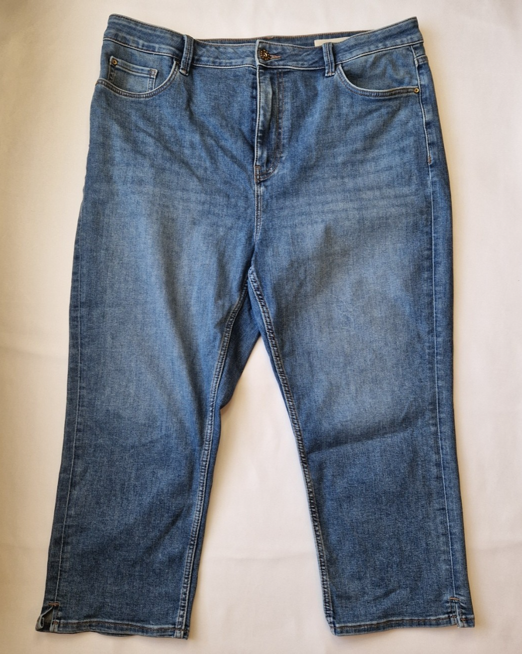 Marks and Spencer mid-rise blue stretch skinny jeans with a five-pocket design.