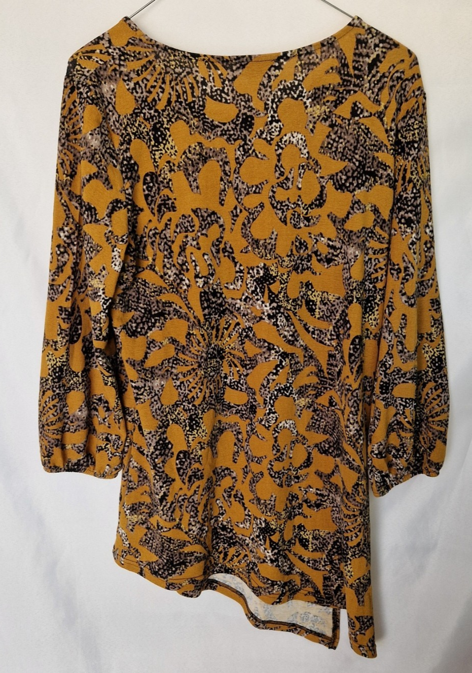 Klass women's yellow long-sleeve tunic top with a black and grey floral print and asymmetric hem.