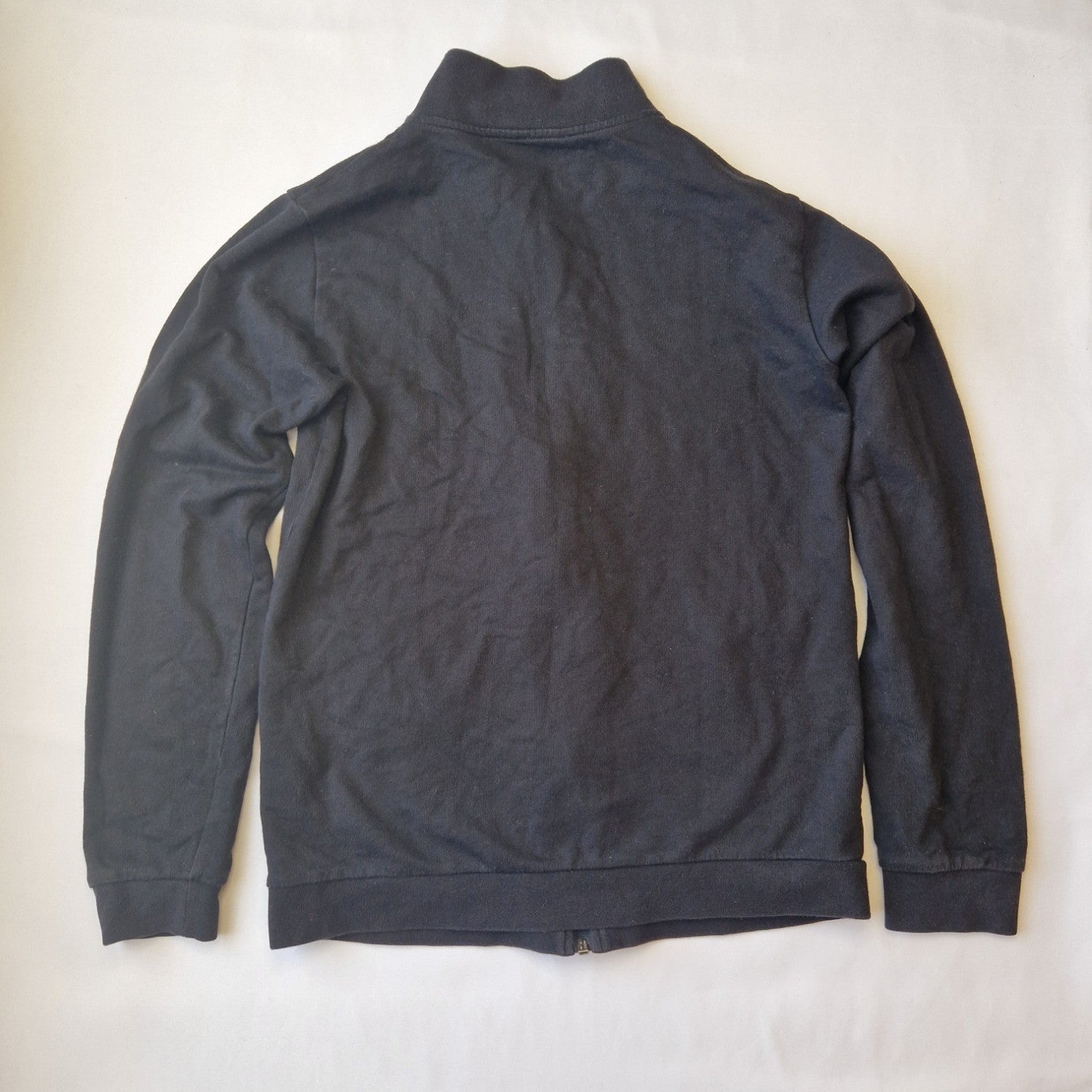 A black EA7 Emporio Armani junior zip-up bomber jacket with a stand-up collar.