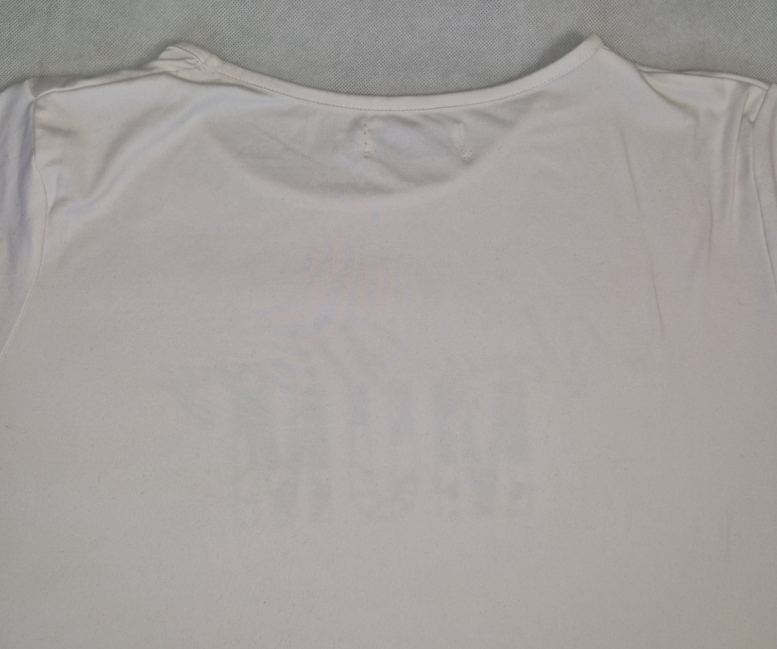 A plain white short-sleeved cotton jersey t-shirt with a round neckline.